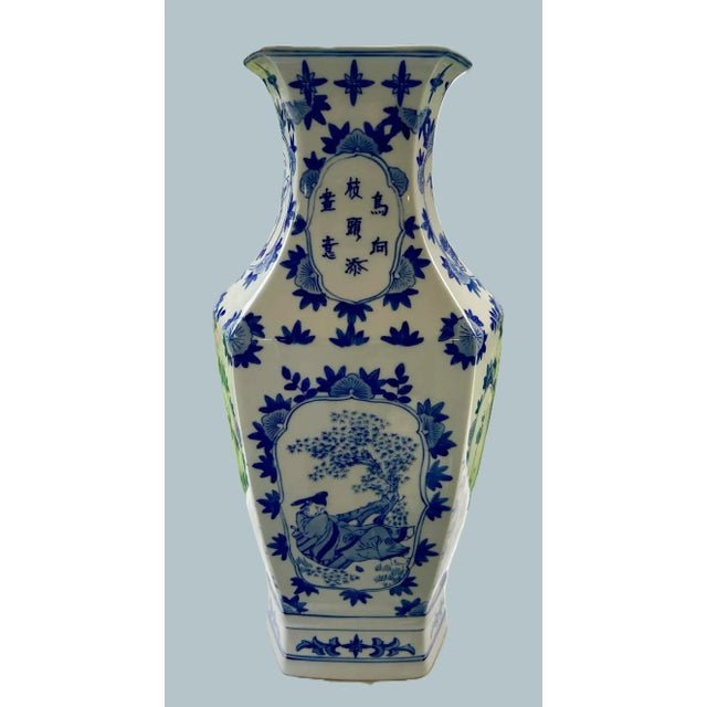 Tall Hexagonal Chinese Porcelain Vase with Blue Floral Motif, c. Late 20th Century A commanding 18-inch porcelain vase...