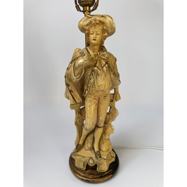 Vintage Claridge Shops figural table lamp featuring an elegantly dressed 18th-century-style gentleman in a wide-brimmed...
