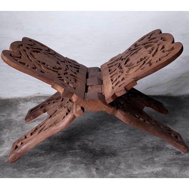 Hand-Carved Wooden Foldable Book Stand - Brown. Hand-carved wooden book stand in rich brown. Features intricate cutwork...