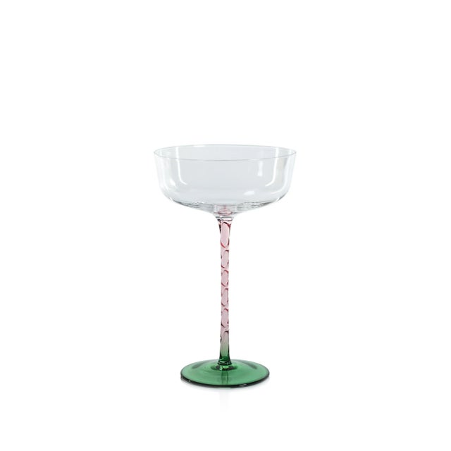 This set includes four cocktail glasses with an elegant design, perfect for enhancing the drinking experience of your...