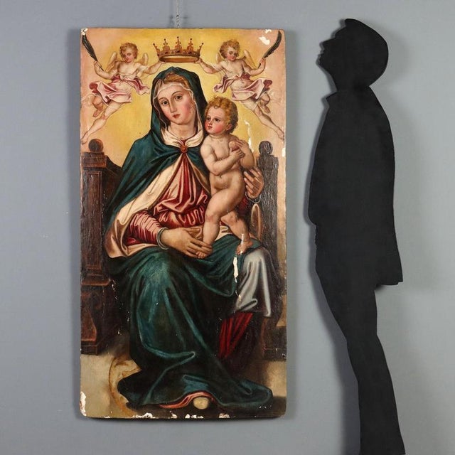Oil on poplar panel depicting the Madonna Enthroned, a work attributed to the Central Italian School of the late 16th and...