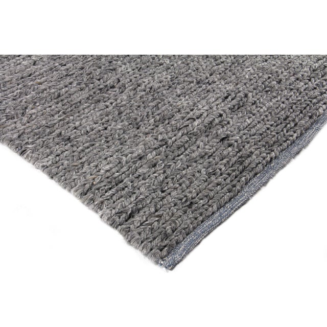 The James Rug brings together a remarkable blend of wool and polyester fibers and neutral tonal shades to create a...