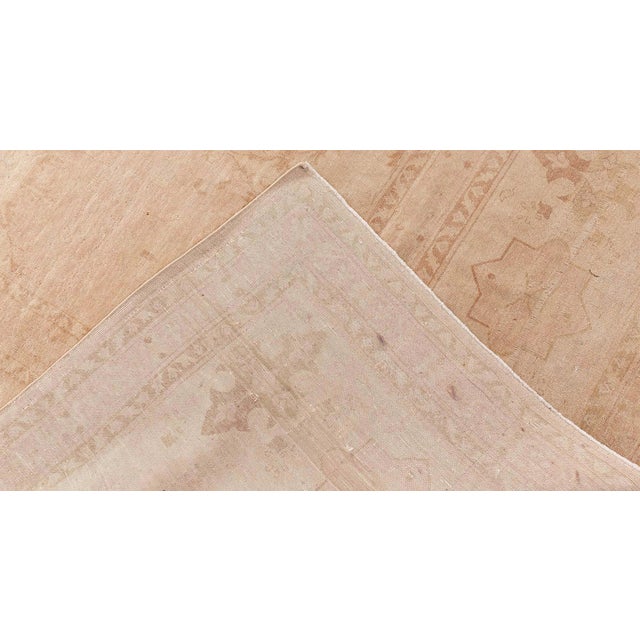 This exceptional hand-knotted wool rug draws inspiration from the esteemed Tabriz weaving tradition, masterfully blending...