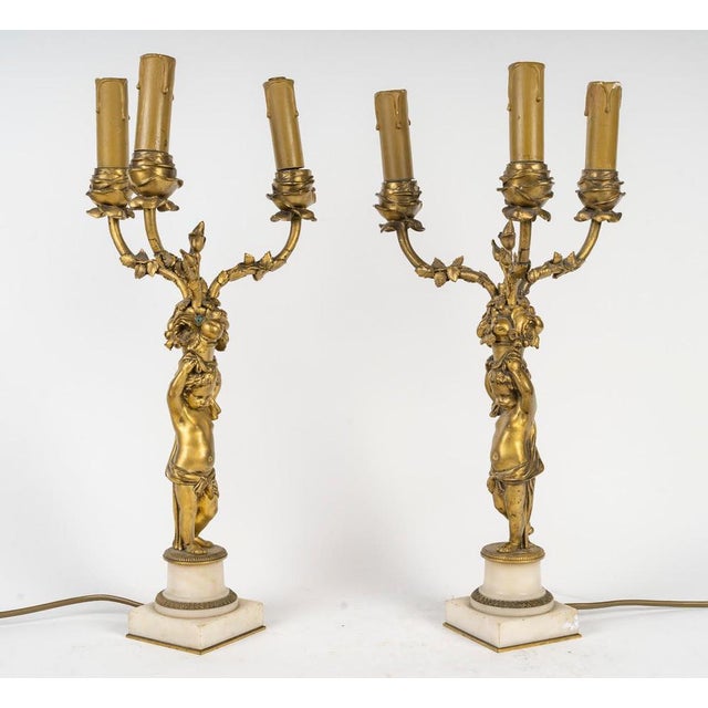 Pair of louis xvi style candelabra, 19th century, signed barbedienne. A pair of gilt bronze candelabra, signed...