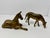 This vintage (c. 1970-1980) set features two solid brass horses in expressive poses: a resting mother mare and a...