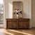 Early 19th Century French Empire Period Walnut Grand Buffet commands attention with grand scale, noble architecture, and...