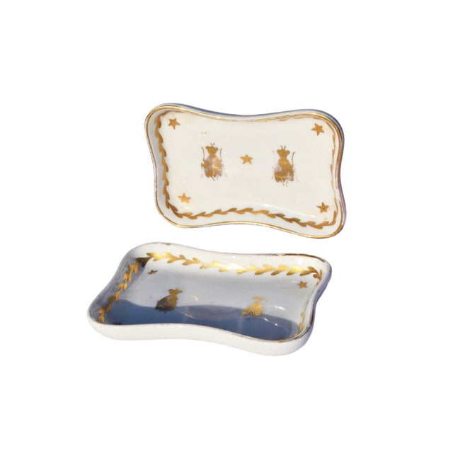 FRENCH PAIR OF NAPOLEON BEE PORCELAIN TRINKET DISHES Era: Early-20th Century Origin: Limoges, France Material: Porcelain...
