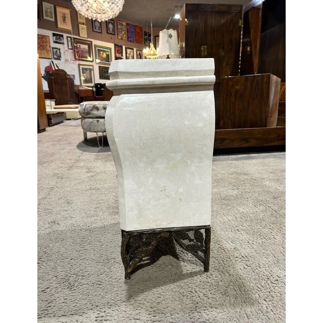 A stunning example of Maitland Smith’s impeccable artistry, this tessellated marble commode exudes timeless sophistication...
