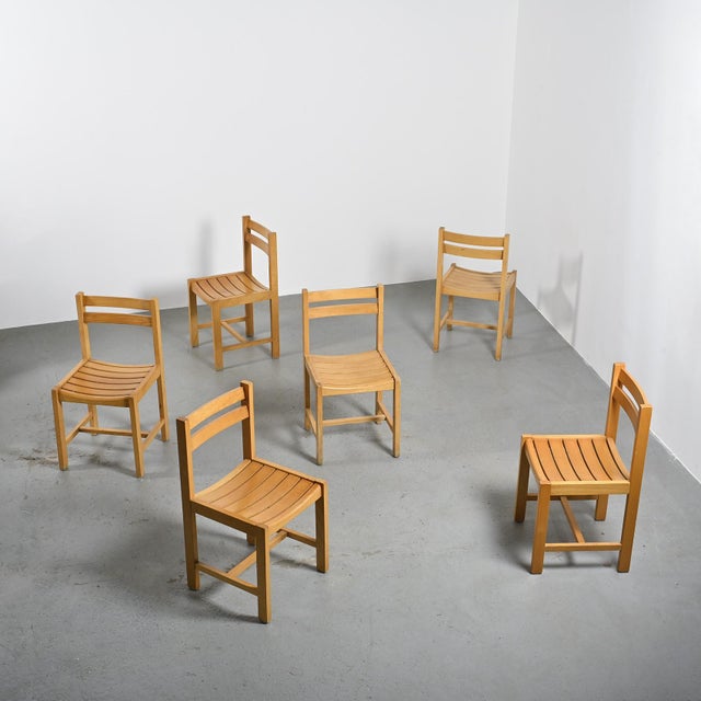 Set of six solid beech chairs designed by André Sornay, a 20th-century Lyon-based designer and decorator, assembled using...