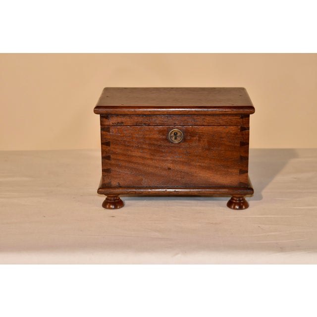 Early 19th century walnut box from England. This is a lovely box with some of the most gorgeous craftsmanship we have had...