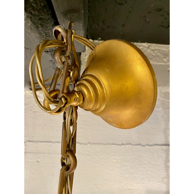 This a great example of a small Baccarat gilt bronze and cut crystal chandelier. The chandelier dates to the late 20th...