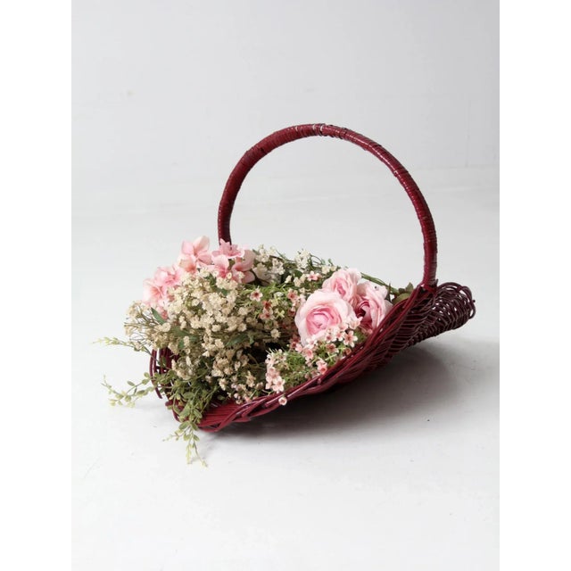 This is a vintage flower basket. The painted wicker basket has a curved open shape ideal for gathering flowers. The rich...