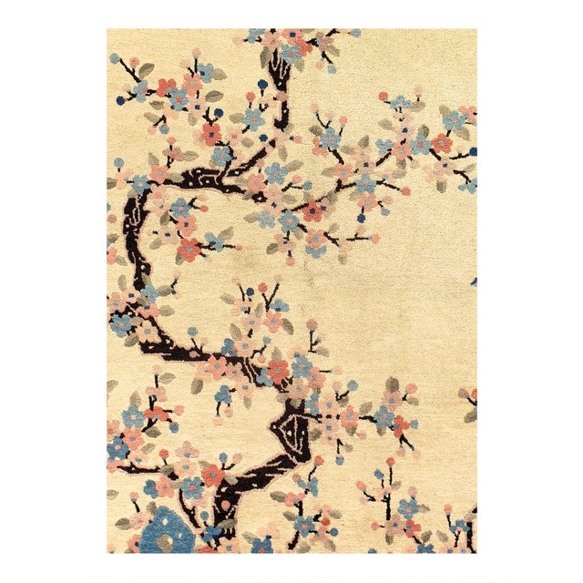 Beautiful antique Art Deco Chinese hand-knotted wool rug with a Beige field. This Chinese rug has a Navy blue frame and...