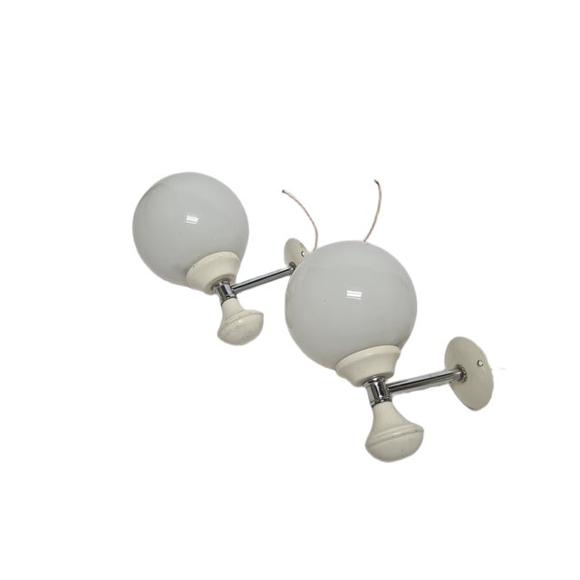 A pair of sconces from the 70s. They are preserved in good condition. European Plug (up to 250V).The wiring of this item...