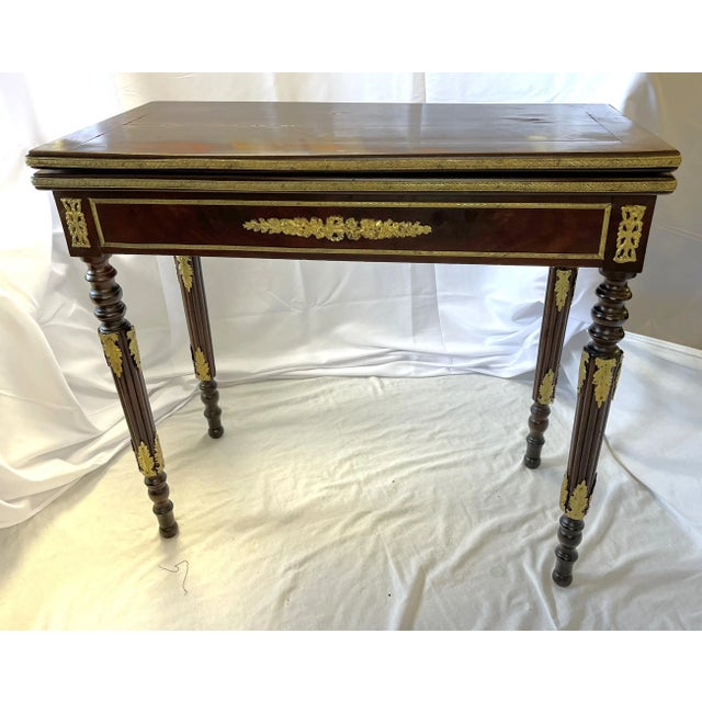 Beautiful antique French Louis XVI style game table from the late 19th Century. The piece is well made of mahogany with a...