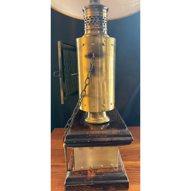 Bring a piece of maritime history into your home with this stunning vintage Captain David Babcock nautical table lamp....