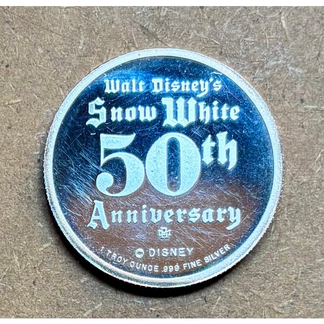 Walt Disney’s, Limited Edition, Snow White 50th Anniversary Disk, featuring Bashful. 999 Fine Silver Round, 1 oz. Produced...