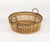 Midcentury beautiful oval bowl or centerpiece in bamboo, rattan and brass with handle. Made in Italy in the 1970s.