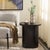 Elevate your living space with the Ekon round end table in a sleek black finish. This versatile piece is crafted from MDF...