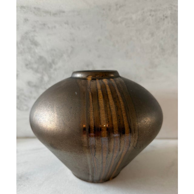 Vintage bronze and gold lustre drip glazed pottery vase circa 1960s/1970s. Numbered on the bottom "540/18".