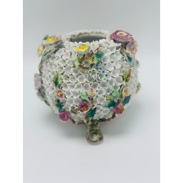 This exquisite vintage porcelain flower encrusted cachepot or votive holder is a remarkable example of highly detailed...