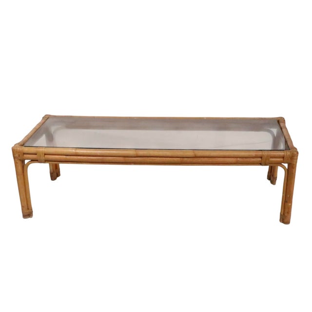 Classic Mid Century, Coastal Tiki, style bamboo coffee table, with tinted glass top. The table is in good, clean, ready to...