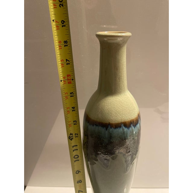 Elevate your home decor with this striking, vintage-inspired studio art pottery bottle vase. Standing tall with an...