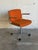 This vintage desk chair combines functional workspace design with clean lines. It features a swivel seat mechanism and...