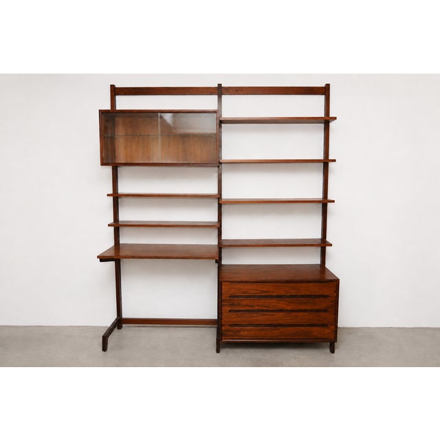Beautiful vintage rosewood wall unit made in Norway, featuring a clean Scandinavian modern design with excellent storage...