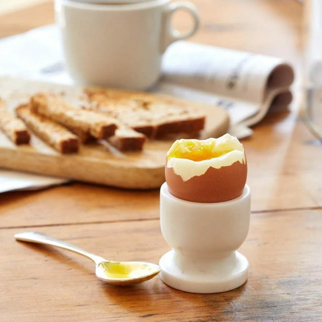 A perfect soft boiled egg is cooked for exactly six minutes in water reduced from a rapid boil to a gentle simmer, then...