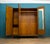 A 1930s Art Deco three-door compactum wardrobe in burr walnut veneer. The doors have bookmatched walnut grain typical of...