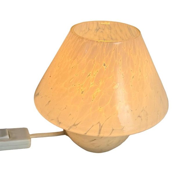 Italian glass lamp made with a swirling motive. Marked with the orinal sticker and in top condition. Measurements: 14 x 16...