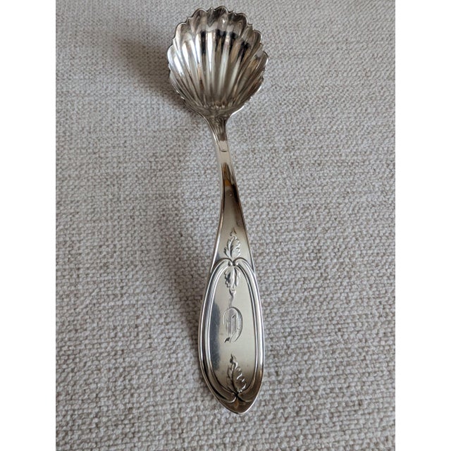 A lovely small sterling silver ladle by Boston silversmiths Bigelow Bros. & Kennard in the "Olive" pattern. The ladle has...