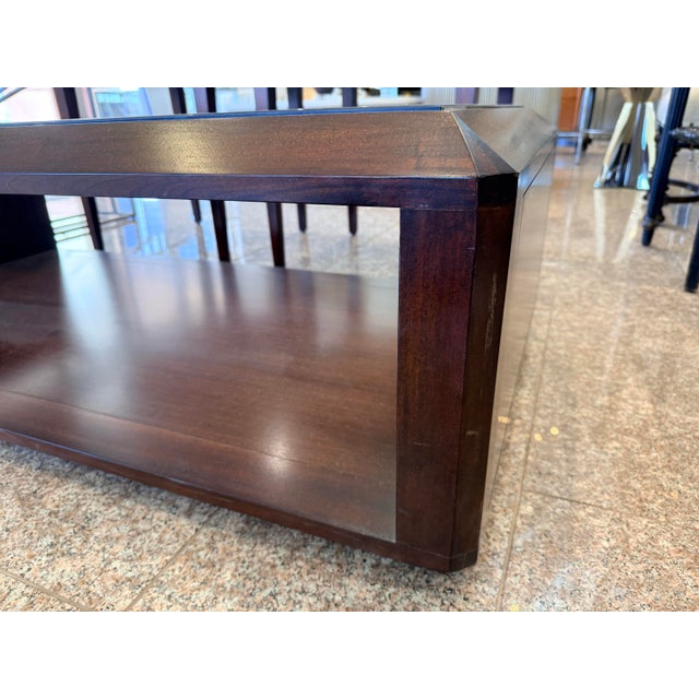 Elegant two-tier cocktail table from Bernhardt Furniture which features glass insert at top and walnut base for second...