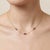 Add a touch of regal elegance to your jewelry collection with this stunning cluster pendant necklace, featuring three...