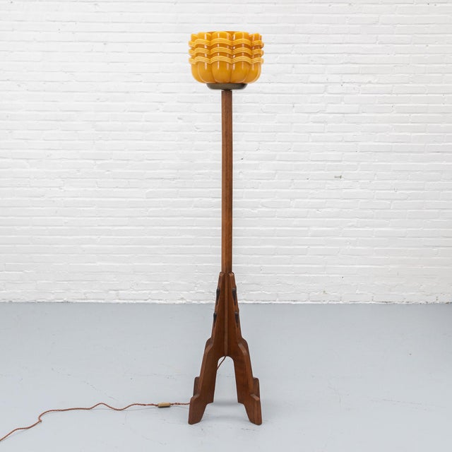 Dutch Amsterdam School floor lamp dating from circa 1925, crafted in oak with dark-stained wooden details. The tall,...
