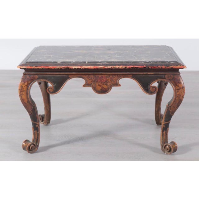 Rococo style marble-top parcel gilt japanned low table, with inset variegated marble top, frame with relief-carved...