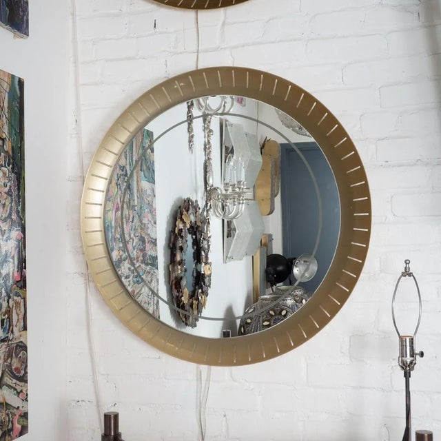 Perforated, concave brass, backlit mirror by Hillebrand in the style of Stilnovo. Newly replaced mirror with frosted trim...