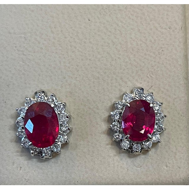 Metal 4 Carat Oval Treated Ruby & 1.2 Ct Diamond Stud Earrings 14 Karat White Gold For Sale - Image 7 of 8