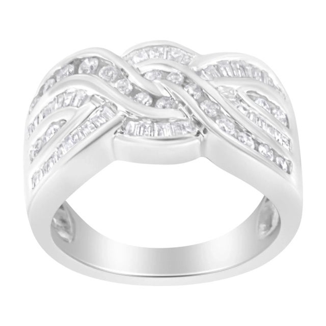 A unique women's diamond bypass ring with an intricate braided design of round and baguette diamonds. The ring is crafted...