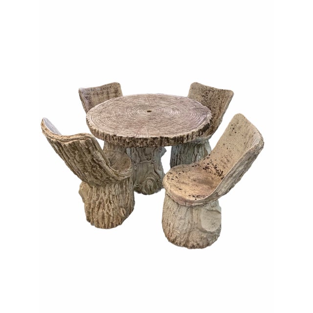 Faux bois garden set including four chairs and one table. Estimated mid century from France. Has a beautiful patina from...
