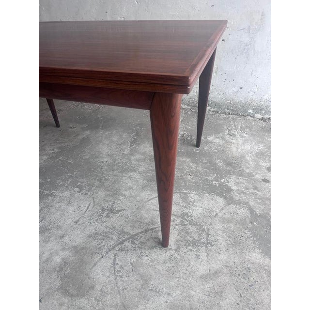 A beautifully crafted danish extendable dining table designed by niels o. Møller, model 254, and manufactured by j.l....