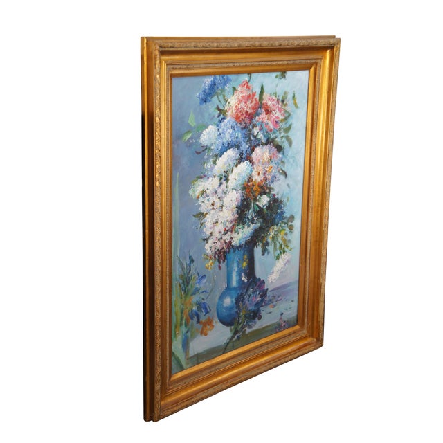 A charming still life oil painting on canvas, circa late 20th century. Features a large bouquet of floral sprays in spring...