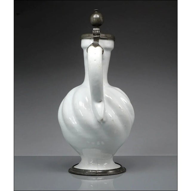 Spectacular piece of antique Delft pottery, circa 1780 (+/-), maker not known. Wonderful handmade jug having a bulbous,...