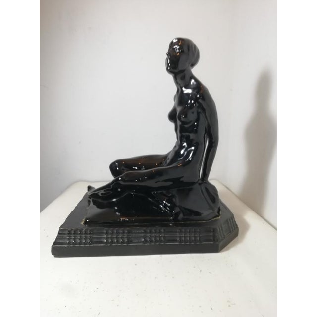 Beautiful ceramic sculpture in the form of a female figure. Total black with a metallic luster. Produced by Riccardo Gatti...