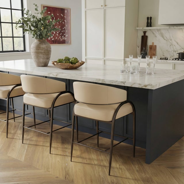 Transform your kitchen with the stunning Tatum Counter Stool, offered in several fabric options. Featuring an antique...