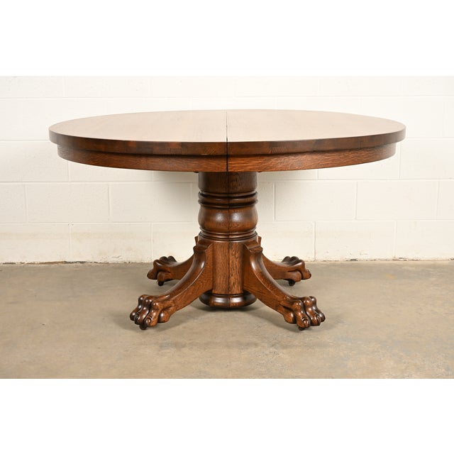 An outstanding antique Victorian, American Empire, or Renaissance Revival split pedestal extension dining table In the...