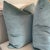 Custom pair of 22” pillows covered in a silk velvet fabric in aqua. These pillows have tapered corners to prevent dog...