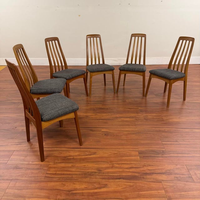 Set of six vintage Danish modern teak dining chairs by Danish designer Benny Linden. Three curved, vertical back slats...