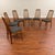 Set of six vintage Danish modern teak dining chairs by Danish designer Benny Linden. Three curved, vertical back slats...